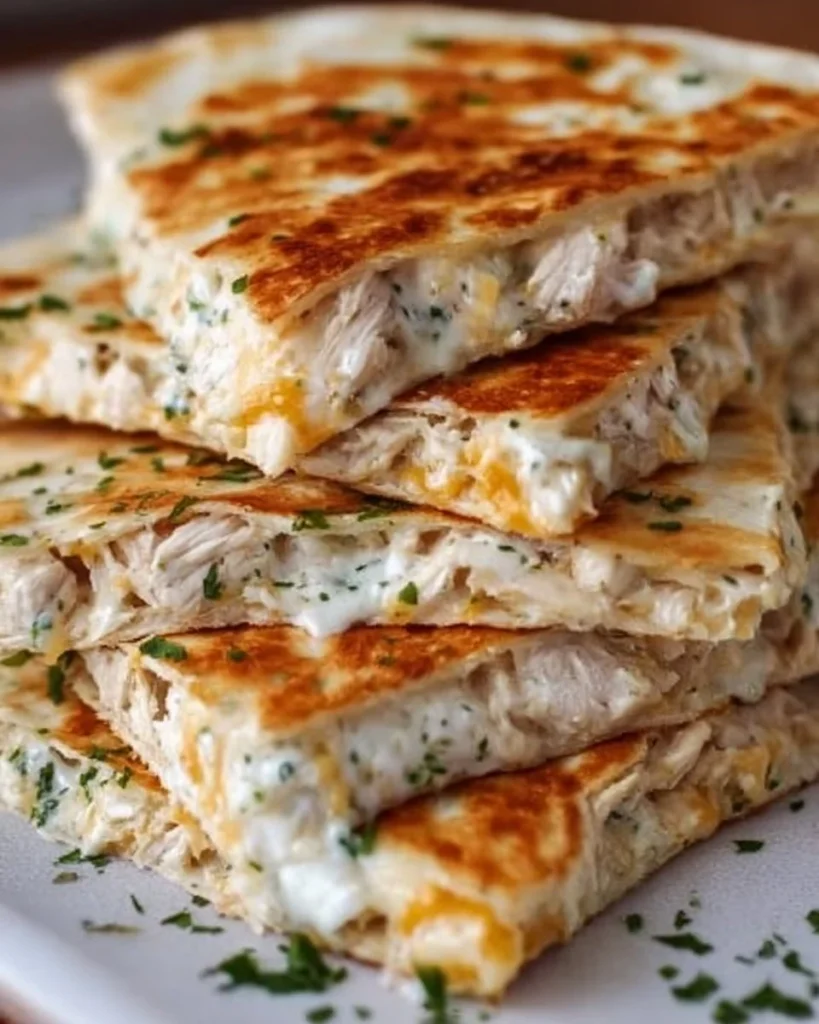 High-protein chicken ranch quesadilla served with fresh toppings