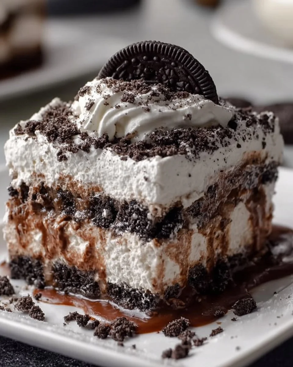 No-Bake Christmas Oreo Lasagna dessert with layers of cream and Oreos