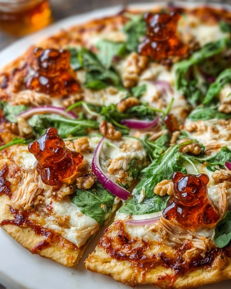 A delicious slice of Honey Bear Pizza with fresh toppings