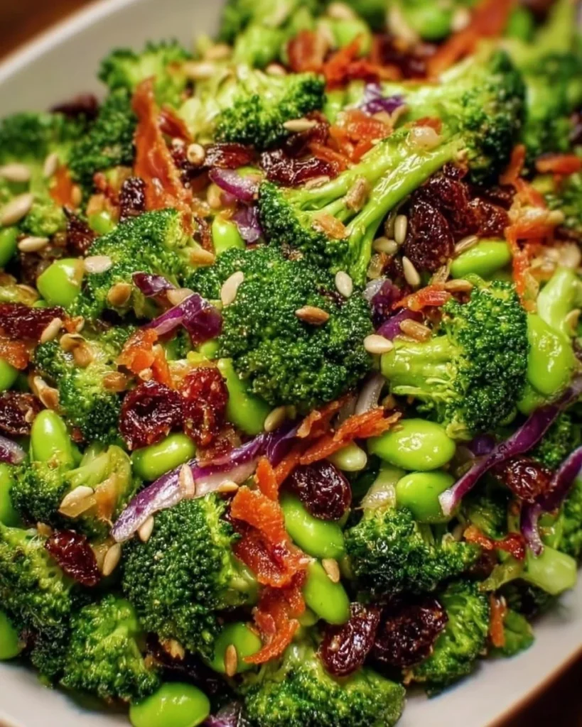 Fresh broccoli salad with vegetables and dressing on a plate