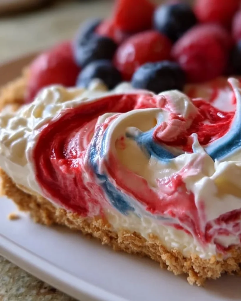 Delicious no-bake swirl pie topped with colorful swirls